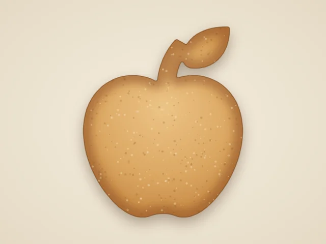 Whole apple with a leaf